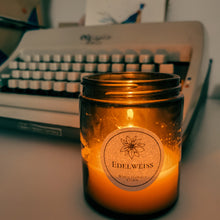 Load image into Gallery viewer, Lit candle with typewriter in background