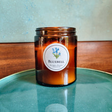 Load image into Gallery viewer, Bluebell candle on blue plate
