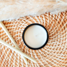 Load image into Gallery viewer, Candle viewed from above on rattan tray with lemongrass sticks