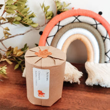 Load image into Gallery viewer, Packaged candle with orange wax seal on top