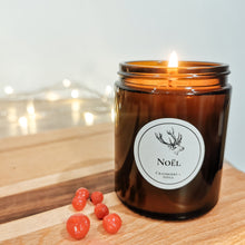 Load image into Gallery viewer, candle lit with lights in background