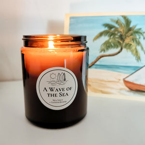 candle lit with beach scene in background