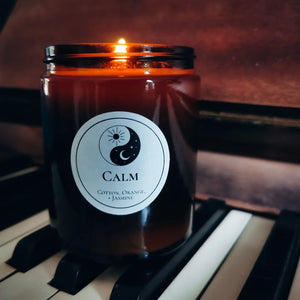 Calm candle on piano keys