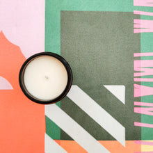 Load image into Gallery viewer, Candle viewed from above on colourful yoga mat

